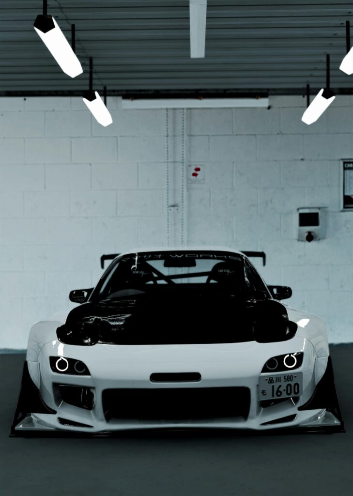 Front view of a sleek sports car parked indoors, showcasing modern design and aerodynamics.