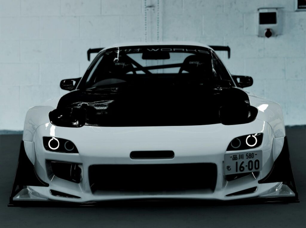 Front view of a sleek sports car parked indoors, showcasing modern design and aerodynamics.